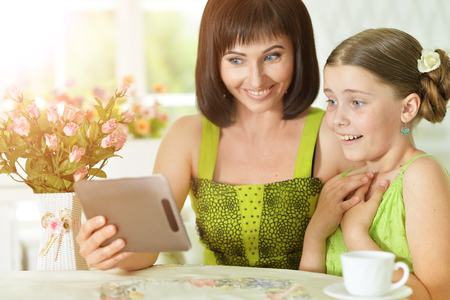 mother and daughter using tabletの写真素材