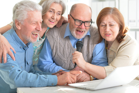 senior couples reading newspaperの写真素材
