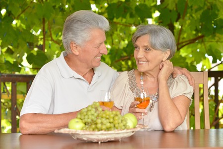 elderly couple drinking wineの写真素材