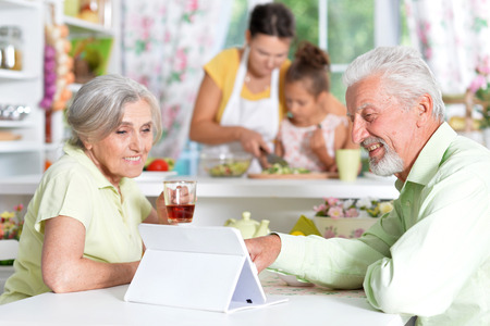 Senior couple looking at tabletの写真素材