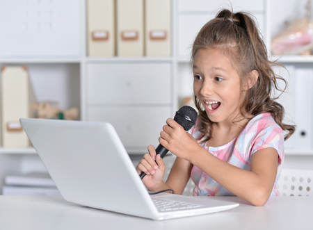 little girl singing karaoke