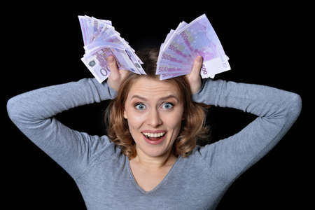 Businesswoman holding dollar banknotesの写真素材