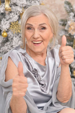 woman posing near  christmas tree