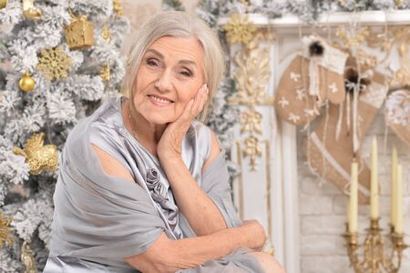 woman posing near  christmas treeの写真素材