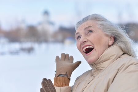 Woman in winter clothes posing