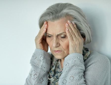 Beautiful sad elderly woman close-upの写真素材