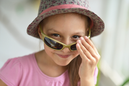 little girl in hat posingの写真素材