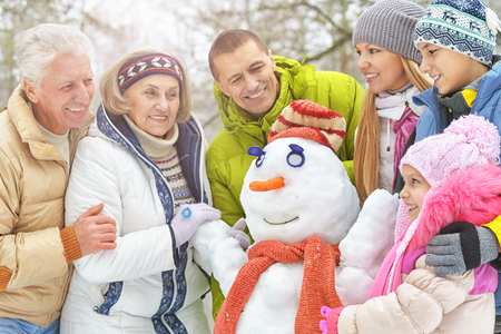 Family in winter parkの写真素材