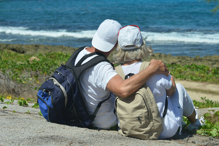 elderly couple  in tropical gardenの写真素材