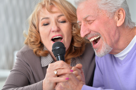 senior couple husband and wife singing songsの写真素材