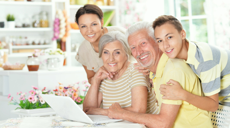Happy family with laptop