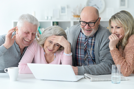 senior couples using laptop