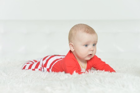 Portrait of adorable baby boy on backgroundの写真素材