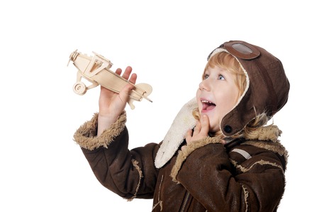 Little boy aviator wit wooden plane toyの写真素材