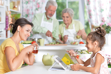 Portrait of mother and daughter having breakfastの写真素材