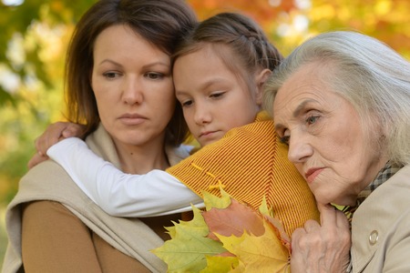 Portrait of Happy family in autumn parkの写真素材