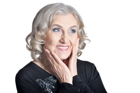 beautiful senior woman smiling on white background