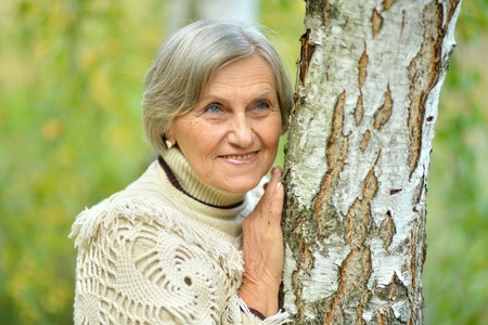 Portrait of senior woman posing in forestの写真素材
