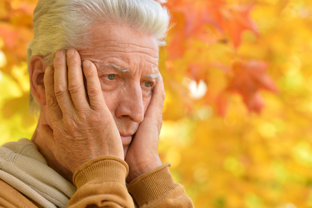 Portrait of a sad senior man outdoorsの写真素材