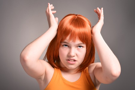 Portrait of beautiful young girl posing in studioの写真素材