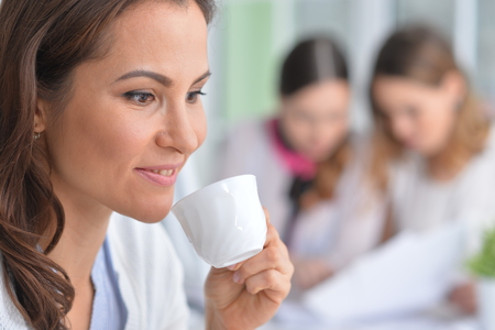 Portrait of a young woman during coffee breakの写真素材