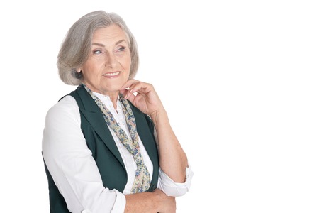 Portrait of beautiful senior woman, posing against white