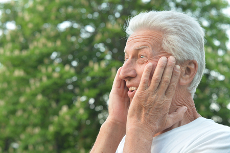 Portrait of a senior man in the parkの写真素材