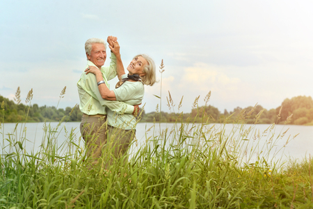 Portrait of a loving senior couple dancingの写真素材