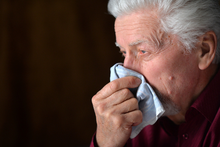 Close up portrait of sick senior manの写真素材