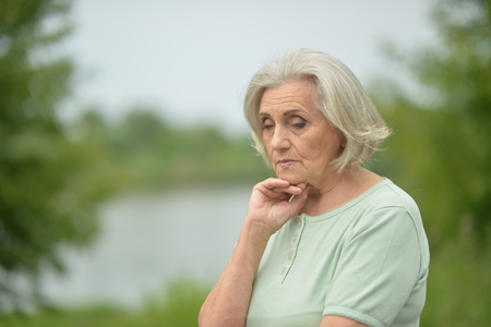 Portrait of sad senior womanの写真素材