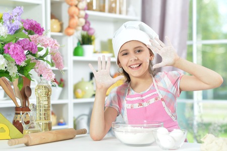 Cute little girl making dinnerの写真素材