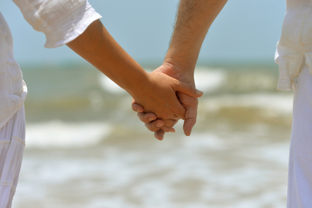 couple holding hands togetherの写真素材