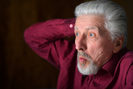 Close up portrait of confident senior man posingの写真素材