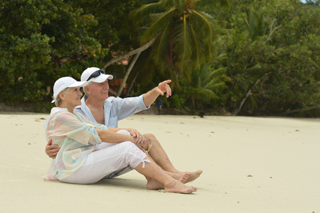 Happy elderly couple sittingの写真素材