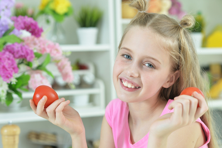 Cute girl preparing delicious fresh saladの写真素材
