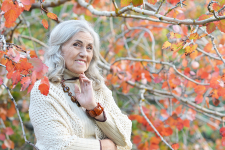 Portrait of happy senior woman in parkの写真素材