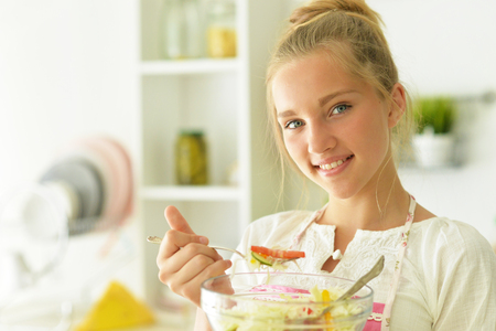 the girl in the kitchenの写真素材