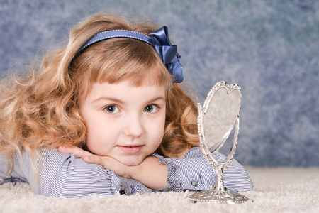 little girl with mirrorの写真素材