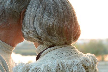 elderly couple at beautiful sunsetの写真素材