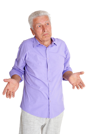 Thougthful senior man close up portrait on white backgroundの写真素材