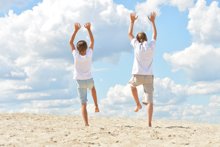 Portrait of boys on a beach on summer dayの写真素材