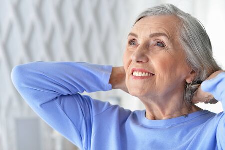 Portrait of happy senior woman at home