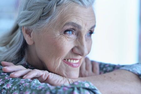 Close up portrait of happy senior womanの写真素材