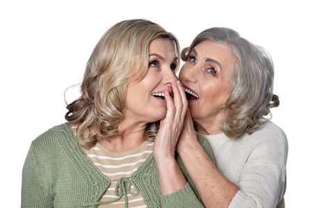 Portrait of two smiling women on white background