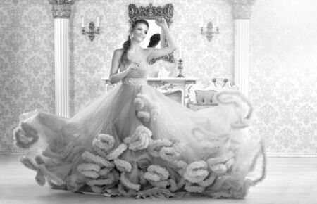 Portrait of beautiful young woman in dressの写真素材