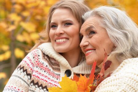 Portrait of senior woman with daughter restingの写真素材