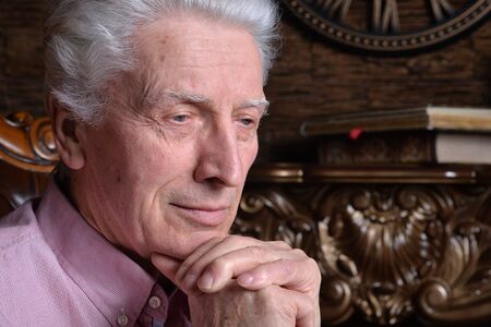 Portrait of a thoughtful senior man posing at home