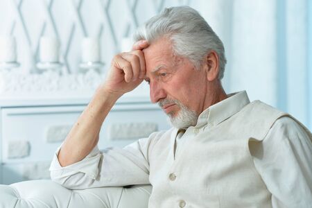 Close up portrait of thoughtful senior manの写真素材
