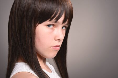 Portrait of girl with dark hair posing