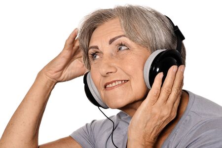 Portrait of senior woman listen a music in headphones